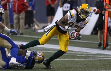 Winnipeg Blue Bombers DB Chris Randle hangs on to stop Edmonton Eskimos WR Derel Walker during CFL action in Winnipeg on Thurs., June 14, 2018. Kevin King/Winnipeg Sun/Postmedia Network