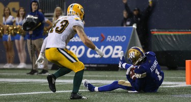 Winnipeg Blue Bombers WR Darvin Adams pulls in a touchdown pass in front of Edmonton Eskimos DB Neil King just before a second weather delay in CFL action in Winnipeg on Thurs., June 14, 2018. Kevin King/Winnipeg Sun/Postmedia Network