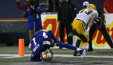 Winnipeg Blue Bombers WR Darvin Adams pulls in a touchdown pass just before a second weather delay in CFL action in Winnipeg on Thurs., June 14, 2018. Kevin King/Winnipeg Sun/Postmedia Network