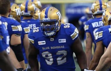 Winnipeg Blue Bombers DT Drake Nevis slaps hands with teammates during player introductions prior to facing the Edmonton Eskimos in CFL action in Winnipeg on Thurs., June 14, 2018. Kevin King/Winnipeg Sun/Postmedia Network