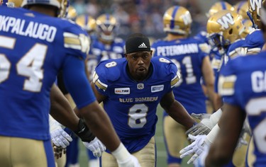 Winnipeg Blue Bombers DB Chris Randle slaps hands with teammates during player introductions prior to facing the Edmonton Eskimos in CFL action in Winnipeg on Thurs., June 14, 2018. Kevin King/Winnipeg Sun/Postmedia Network
