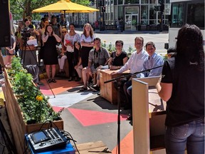 Representatives of Downtown Winnipeg BIZ and the Manitoba Institute of Trades and Technology along with Mayor Brian Bowman and Councillors Jenny Gerbasi, John Orlikow and Cindy Gilroy announce the opening of two new pop-up parks in downtown Winnipeg on Friday.