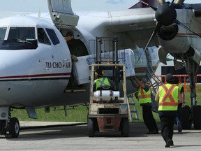 A refrigeration unit is loaded onto a plane at Winnipeg International Airport on Sun., June 17, 2018. The Canadian Red Cross is flying nearly 800 fridges and freezers to Pauingassi and Little Grand Rapids First Nations to replace units that had to be removed after residents were forced out of their homes by wildfires. Kevin King/Winnipeg Sun/Postmedia Network