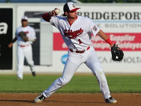 Winnipeg Goldeyes 2B Matt McCann throws a batter out at first base during American Association action against the Kansas City T-Bones in Winnipeg on Tuesday. McCann is one of an unusually high number of players from cold-weather backgrounds on the Goldeyes' roster.