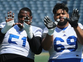 Sukh Chungh (right), Jermarcus Hardrick and the rest of the Winnipeg Blue Bombers will be going for the win in Montreal on Friday. The offensive lineman make the hand signal at practice on Wed., June 20, 2018. Kevin King/Winnipeg Sun/Postmedia Network