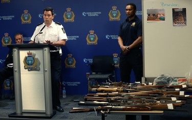 Insp. Eric Luke (left), with Cst. Trevor Ogwal of the Firearms Investigative Analysis Section, speaks to some of the weapons turned in so far during the 2018 Manitoba Gun Amnesty initiative at Winnipeg police headquarters on Smith Street on Thurs., June 21, 2018. Kevin King/Winnipeg Sun/Postmedia Network