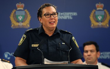 Cst. Tammy Skrabek, a Winnipeg police spokeswoman, speaks to some of the weapons turned in so far during the 2018 Manitoba Gun Amnesty initiative, at police headquarters on Smith Street on Thurs., June 21, 2018. Kevin King/Winnipeg Sun/Postmedia Network