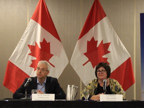 Scott Streiner, chair and CEO of Canadian Transport Agency (CTA), and Liz Barker, CTA vice-chair, listen to recommendations for improved air passenger rights at a public consultation at the Delta Hotel in Winnipeg on Monday