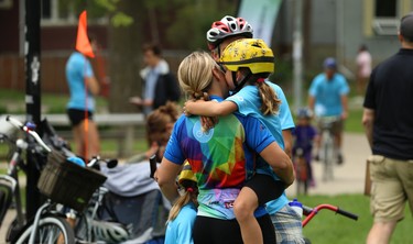 Hugs for mom after completing the Ride Don't Hide event in support of mental health at Vimy Ridge Park in Winnipeg on Sun., June 24, 2018. Kevin King/Winnipeg Sun/Postmedia Network