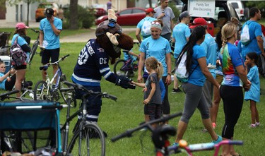 Winnipeg Jets mascot Mick E. Moose slaps hands at the Ride Don't Hide event in support of mental health at Vimy Ridge Park in Winnipeg on Sun., June 24, 2018. Kevin King/Winnipeg Sun/Postmedia Network