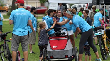 High-fives after finishing the Ride Don't Hide event in support of mental health at Vimy Ridge Park in Winnipeg on Sun., June 24, 2018. Kevin King/Winnipeg Sun/Postmedia Network