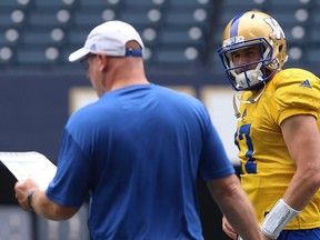 Chris Streveler (right) checks in with offensive co-ordinator Paul LaPolice during Winnipeg Blue Bombers practice on Mon., June 25, 2018. Kevin King/Winnipeg Sun/Postmedia Network