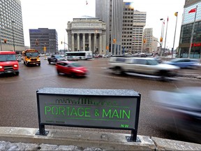 Traffic crosses Main Street at Portage Avenue in Winnipeg.