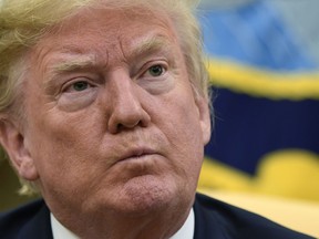 U.S. President Donald Trump listens during his meeting with Japanese Prime Minister Shinzo Abe in the Oval Office of the White House in Washington on Thursday, June 7, 2018.