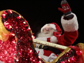 Santa Claus waves to his thousands of fans during the Winnipeg Santa Claus Parade presented by Manitoba Hydro in Winnipeg, Man., on Saturday, Nov.18, 2017. (Brook Jones/Postmedia Network)