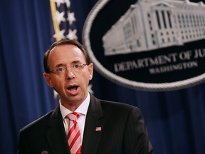 U.S. Deputy Attorney General Rod Rosenstein (C) holds a news conference at the Department of Justice July 13, 2018 in Washington, DC. (Chip Somodevilla/Getty Images)