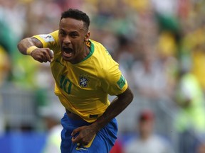 Brazil's Neymar celebrates after scoring his side's opening goal during the round of 16 match between Brazil and Mexico at the 2018 soccer World Cup in the Samara Arena, in Samara, Russia, Monday, July 2, 2018.