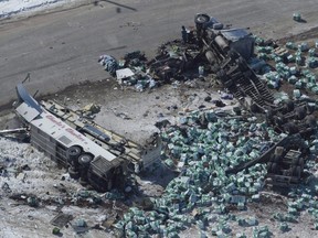 The wreckage of a fatal crash outside Tisdale, Sask., is seen April, 7, 2018. Internal government documents show Ottawa considered speeding up a new rule for bus seatbelts after the Humboldt Broncos bus crash.