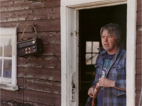 Robert Latimer leaves the workshop at his farm north of Wilkie, Sask., in May 1999.