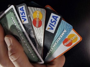 Consumer credit cards are posed in North Andover, Mass. on March 5, 2012.