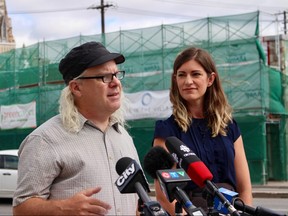 Bike Winnipeg executive director Mark Cohoe (left) speaks with the media on Tuesday on Osborne Street along with CAA corporate manager of government and community relations Liz Kulyk. The two organizations released the findings of a recent survey done by Probe Research regarding cycling in the city. 
Scott Billeck/Winnipeg Sun