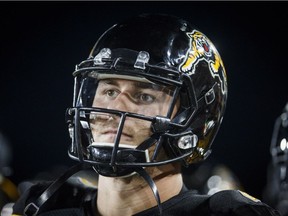 Hamilton Tiger-Cats quarterback Johnny Manziel looks on from the sidelines during second half CFL football action against the Saskatchewan Roughriders, in Hamilton, Ont., on July 19, 2018.