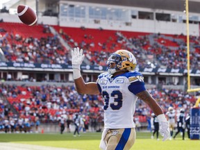 Winnipeg Blue Bombers' Andrew Harris celebrates his touchdown during first-half CFL action against the Argonauts in Toronto on Saturday, July 21, 2018. (MARK BLINCH/THE CANADIAN PRESS)