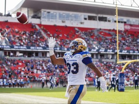 Winnipeg Blue Bombers' Andrew Harris celebrates his touchdown during first half CFL football action against the Toronto Argonauts, in Toronto on Saturday, July 21, 2018. THE CANADIAN PRESS/Mark Blinch ORG XMIT: MDB110