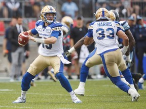 Winnipeg Blue Bombers quaterback Matt Nichols scrambles during first half CFL football action against the Toronto Argonauts, in Toronto on Saturday, July 21, 2018. THE CANADIAN PRESS/Mark Blinch ORG XMIT: MDB119