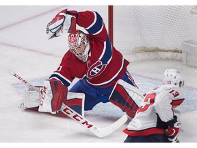 Canadiens goaltender Carey Price makes a save against Washington Capitals' Jakub Vrana during first period NHL hockey action in Montreal on Saturday, March 24, 2018.