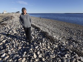Florence Hamilton, a descendent of the original Sayisi Dene settled in the area, speaks and educates about indigenous culture in Churchill, Manitoba, Tuesday, July 3, 2018. Spence walks along the beach where her ancestors were first brought to when they were settled. The closure of the port and the rail line has resulted in economic hardship in the community. THE CANADIAN PRESS/John Woods