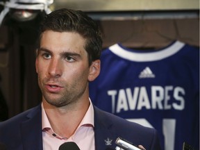 Toronto Maple Leafs John Tavares speaks to the media at his locker after signing on for a seven-year $77 million contract on Sunday.