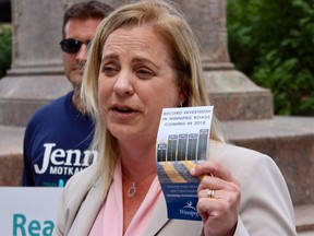 Mayoral candidate Jenny Motkaluk holds a leaflet from the city show the record number of dollars being spent this year on road and sidewalk renewal work.