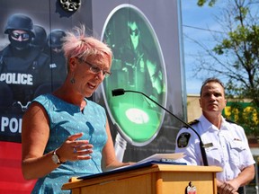 Dr. Ginette Poulin, medical director at the Addictions Foundation of Manitoba, is flanked by Winnipeg police chief Danny Smyth during a press conference on Wednesday, July 18, at a Safeway on Sargent Avenue. 
Scott Billeck/Winnipeg Sun