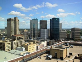 The view of Winnipeg's skyline surrounding Portage Avenue and Main Street from the top floor of the 17-storey True North Square office building in Winnipeg on July 23, 2018.