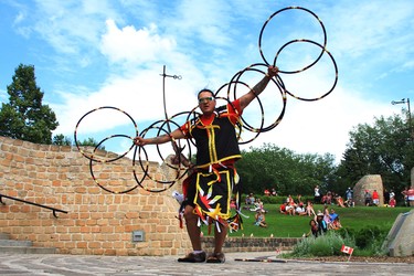 Christopher Beaulieu performs a hoop dance at the Tribal Villages Powwow in the Oodena Celebration Circle at The Forks for Canada Day 151 in Winnipeg on Sunday July 1, 2018.