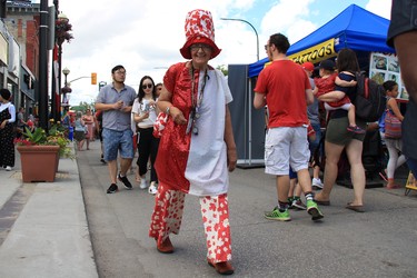 Kathy Taylor celebrates Canada Day dressed in a red and white at the TELUS Osborne Village Street Festival and Canada Day Celebration in Winnipeg on Sunday, July 1, 2018.