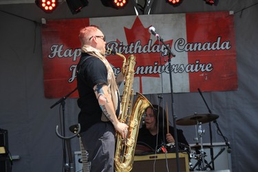 Peter Vanderhout plays the saxophone with his band, the Disraeli Dreamers at the TELUS Osborne Village Street Festival and Canada Day Celebration in Winnipeg on Sunday, July 1, 2018.