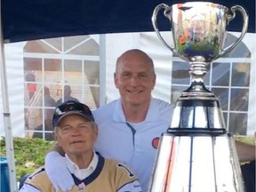 (Left to right) Former Winnipeg Blue Bombers quarterback and Hall of Famer Ken Ploen with Keeper of the Grey Cup, Jeff McWhinney, taken at the Winnipeg-B.C. game, on Saturday.