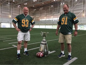(Left to right) Keeper of the Cup, Jeff McWhinney with Jackie Parker, Jr., son of the legendary Edmonton quarterback in Edmonton in late June, 2018, by Grey Cup Festival committee member Gerald Lavoie.
