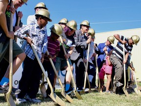 Members of five families set to move into brand new, state-of-the-art energy-efficient Habitat for Humanity homes broke ground on the construction at a ceremony at 1860 Logan Avenue on Tuesday, July 10, 2018 in Winnipeg.