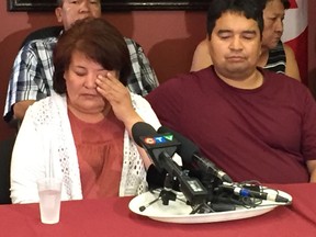 Left to right) Jeanette Shaoullie wipes tears from eyes as she and Tom Shaoullie address the media at a press conference at the Manitoba Keewatinowi Okimakanak (MKO) offices in Winnipeg on Tuesday. The family of Russell Hyslop are urging the people of Thompson and all Manitobans to keep a look out for the missing man or anything altered or different in their neighbourhood.