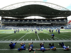 The Winnipeg Blue Bombers loosens up during practice at Investors Group Field on Tues., July 24, 2018. Kevin King/Winnipeg Sun/Postmedia Network