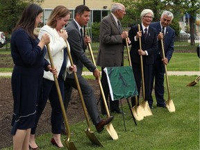 Mayor Brian Bowman (third from left) works the shovel during a ground-breaking event to recognize the start of the Royal Winnipeg Rifles Memorial renovation and expansion project at Vimy Ridge Memorial Park in Winnipeg on Tuesday. With the mayor, from left, are: Pamela Shaw, Veteran Affairs Canada program director; Megan Tate, director of community grants at the Winnipeg Foundation; Ray Crabbe, president of the Royal Winnipeg Rifles Foundation; Emoke Szathmary, Rifles honorary colonel; and, Albert El Tassi, Rifles honorary lieutenant-colonel.