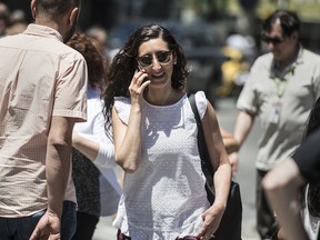 TORONTO, ONTARIO: JUNE 19, 2018óCOMMUNICATIONSóA woman walks down Yonge Street and Dundas Street in Toronto using her cellphone, Tuesday June 19, 2018.  [Photo Peter J Thompson] [For National story by TBA/National]