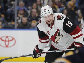 FILE - In this March 2, 2017, file photo, Arizona Coyotes forward Shane Doan (19) looks on during the first period of an NHL hockey game against the Buffalo Sabres in Buffalo, N.Y. The Coyotes will retire Doan's No. 19 during a pregame ceremony on Feb. 24, 2019, when they face the Winnipeg Jets. Doan spent his entire 21-year career with the Coyotes before retiring prior to the 2017-18 season. (AP Photo/Jeffrey T. Barnes, File)