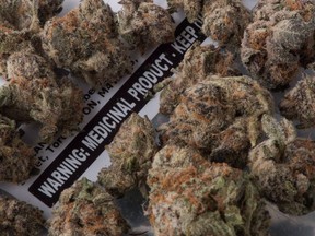 Medical marijuana is shown with its packaging label in Toronto, Nov. 5, 2017. A new medical guideline suggests family doctors should take a "sober second thought" before prescribing medical marijuana to their patients.