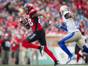 Winnipeg Blue Bombers' Maurice Leggett, right, chases Calgary Stampeders' Kamar Jorden during second half CFL football action in Calgary, Saturday, Aug. 25, 2018.THE CANADIAN PRESS/Jeff McIntosh ORG XMIT: JMC115