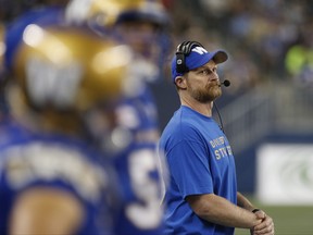 Winnipeg Blue Bombers head coach Mike O'Shea looks up at the scoreboard as they play the Ottawa Redblacks during the second half of CFL action in Winnipeg Friday, August 17, 2018. THE CANADIAN PRESS/John Woods ORG XMIT: JGW120