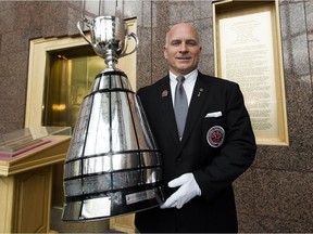 The Keeper, Jeff McWhinney, holds the Grey Cup on Thursday, May 31, 2018 in Edmonton.
